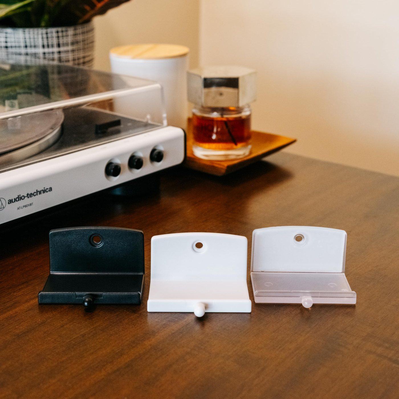 Album and record displays in three colors next to a turntable