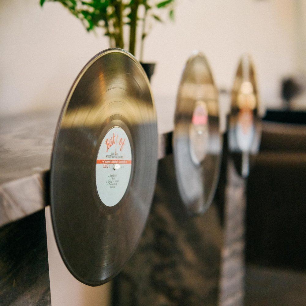 Vinyl records displayed on Modern JP record disc wall pegs