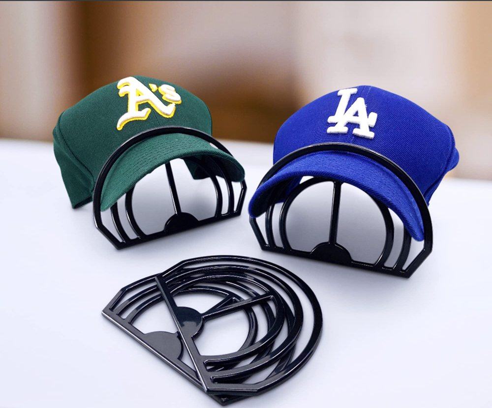 Two baseball caps shaped with Modern JP hat brim benders